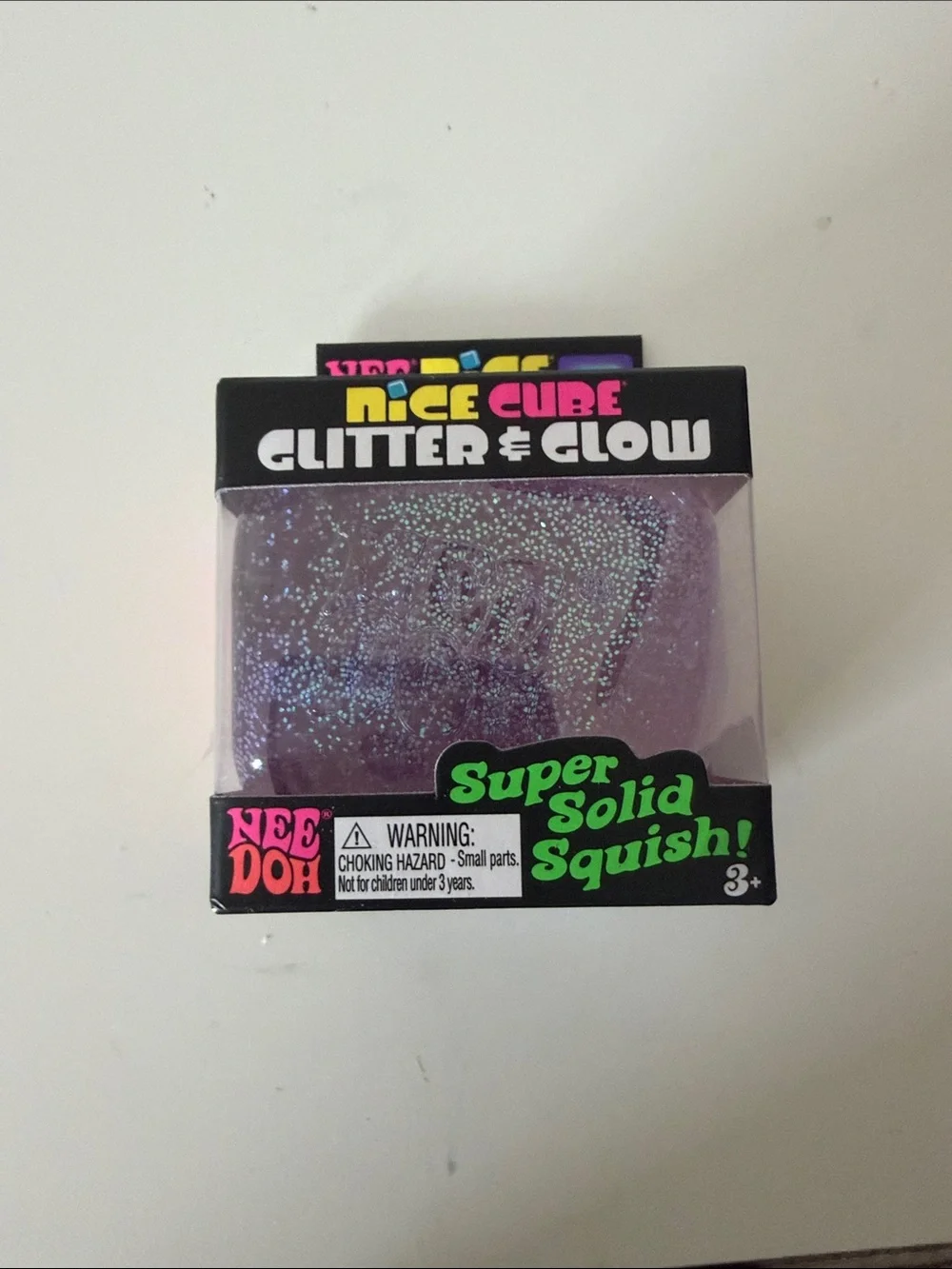 NEW unopened NeeDoh Nice Cube Glitter & Glow. Color purple.
